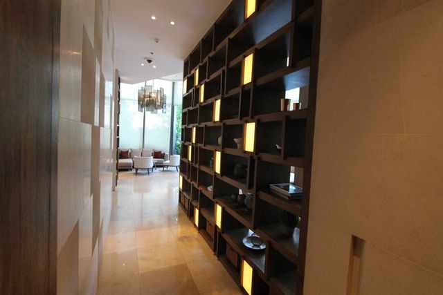 Corridor with illuminated bookshelves
