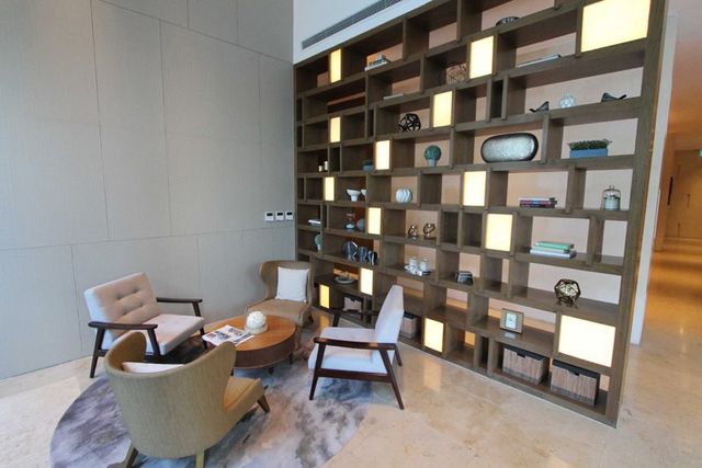 Residents' lounge beside the bookshelf wall